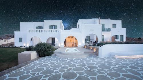 a large white house with a starry sky at Naxos Euphoria Suites in Stelida