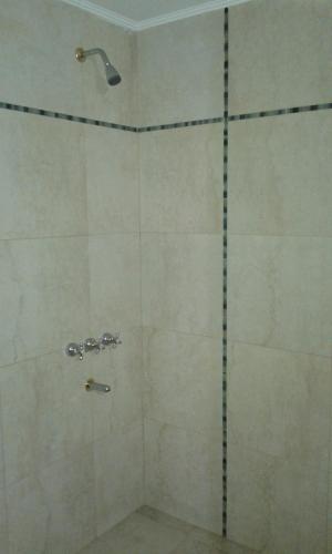 a shower with a glass door in a bathroom at Casa Picoco in San Bernardo