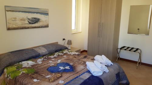 Postel nebo postele na pokoji v ubytování Il Giardino dei Limoni Room & Apartments