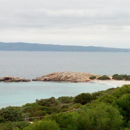 an island in the middle of a body of water at Domos Le Due Tuie in Piscinas
