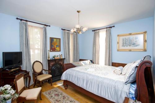 Historic Sion Bass Guest House tesisinde bir odada yatak veya yataklar