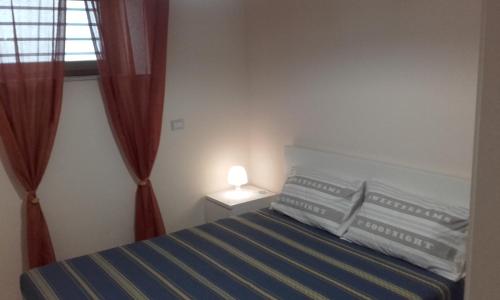 A bed or beds in a room at B&B la Palma