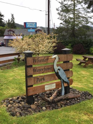 a sign with a bird on it in a park at Wheeler on the Bay Lodge and Marina in Wheeler