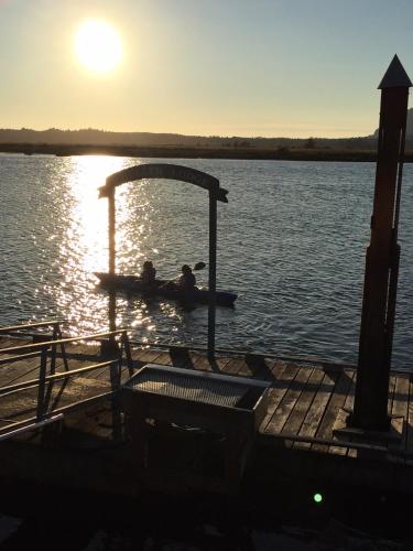 two people are sitting on a boat in the water at Wheeler on the Bay Lodge and Marina in Wheeler