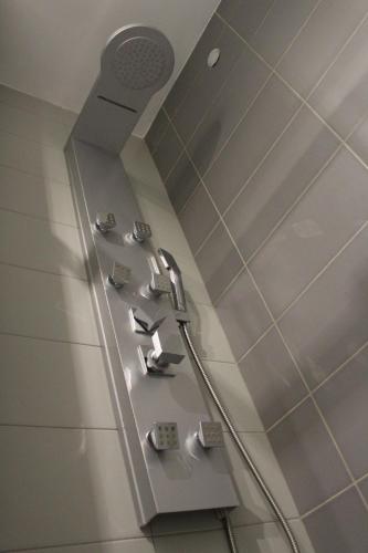 a shower stall in a bathroom with a sink at Galaxy Hotel in Athens