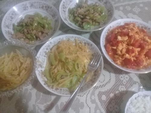 a table topped with bowls of different types of food at Galle Rest Home in Galle