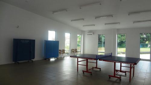 a room with a table and chairs and windows at Mahkota Cheras Sweet Condo 1-14 pax near MRT to KL in Kuala Lumpur