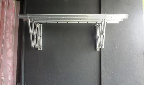 a closet with a white rack on the wall at Mahkota Cheras Sweet Condo 1-14 pax near MRT to KL in Kuala Lumpur