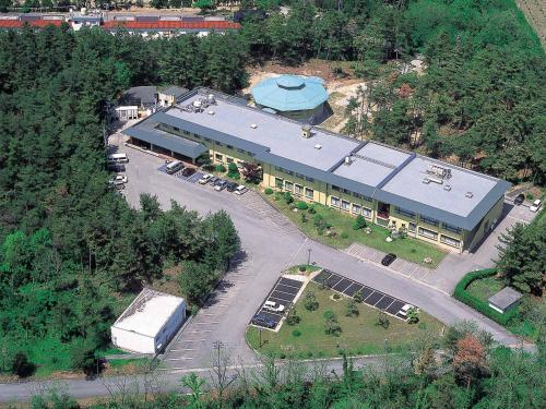 an overhead view of a large building with a truck at Hotel Wellness Notoji in Hakui