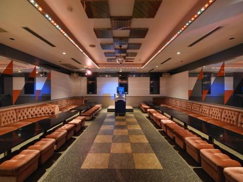an empty theatre with leather seats and a stage at Hotel Wellness Notoji in Hakui