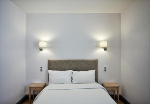 Cama o camas de una habitación en Hôtel Henri IV
