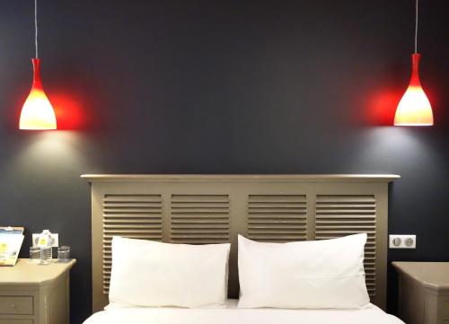 Cama o camas de una habitación en Hôtel Henri IV