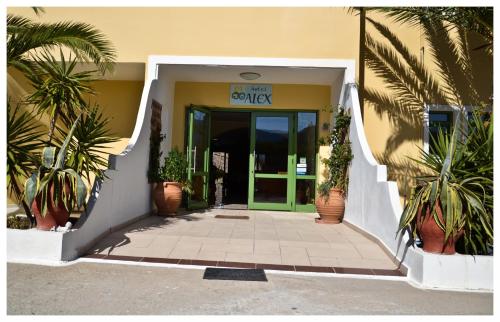 an entrance to a building with a green door at Alex in Karpathos Town
