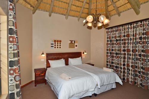 Krevet ili kreveti u jedinici u okviru objekta Hlalanathi Drakensberg Resort