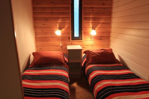 Ein Bett oder Betten in einem Zimmer der Unterkunft Seita Mökki, Äkäslompolo