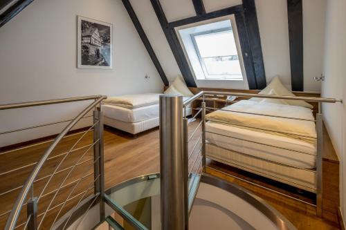 a room with two bunk beds and a window at Neumühle Resort & Spa in Hammelburg