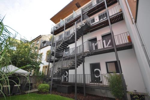 a building with stairs on the side of it at Apart2stay in Luxembourg
