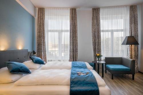 Säng eller sängar i ett rum på Hotel Ruf