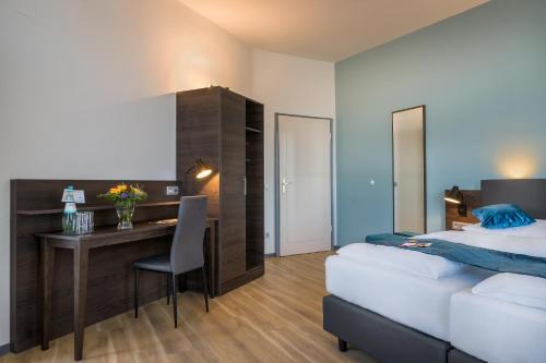Letto o letti in una camera di Hotel Ruf