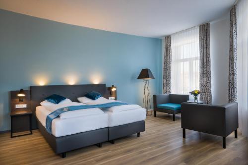 Letto o letti in una camera di Hotel Ruf