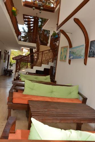 a room with a row of beds with pillows at Kaliptus Hotel in Kemer