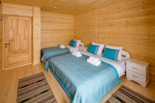 Postel nebo postele na pokoji v ubytování Family Hotel Kaskad