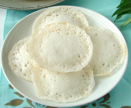 a white plate of tortillas on a table at Willow Heights in Athirappilly