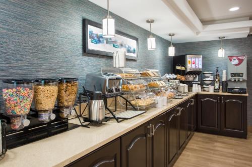 a bakery with a counter with food on it at Milford Inn in Milford