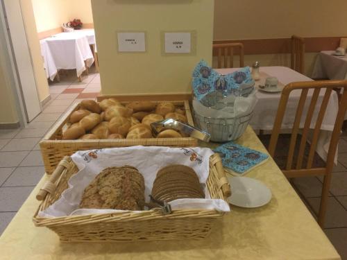 a basket of bread sitting on top of a table at Hotel Admiral in Vienna
