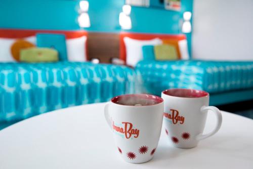 
a coffee cup sitting on top of a white table at Universal's Cabana Bay Beach Resort in Orlando
