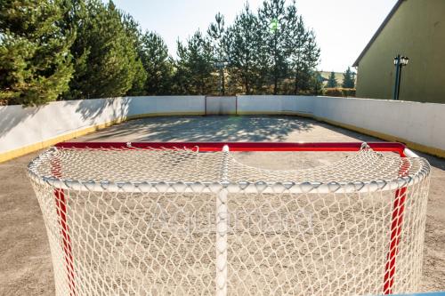 a basketball court with a net on top of it at Aquamara Aquapark Tatralandia in Liptovský Mikuláš