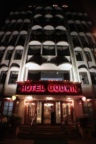 a hotel goatown sign in front of a building at Hotel Godwin - Colaba in Mumbai