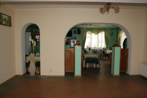a room with a dining room with a table at Комплекс отдыха "Престиж" in Boryspilʼ