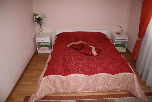 a bedroom with a bed with two pillows on it at Комплекс отдыха "Престиж" in Boryspilʼ