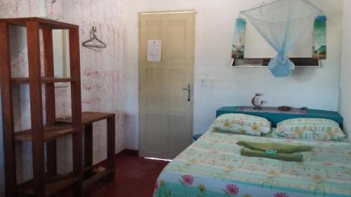 Ein Bett oder Betten in einem Zimmer der Unterkunft Pousada e Restaurante Tremembé