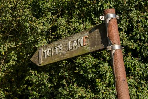 a sign that says tigers lane on a pole at The Old Nurseries B & B in Stathern