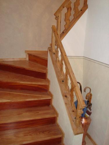 a staircase with wooden treads in a house at Casa Andreola in Valfurva