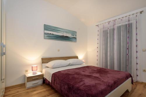 Posteľ alebo postele v izbe v ubytovaní Apartmani Beran
