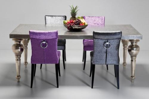 a table with purple chairs and a bowl of fruit at DELUXE APARTMENTS - free parking in Drama