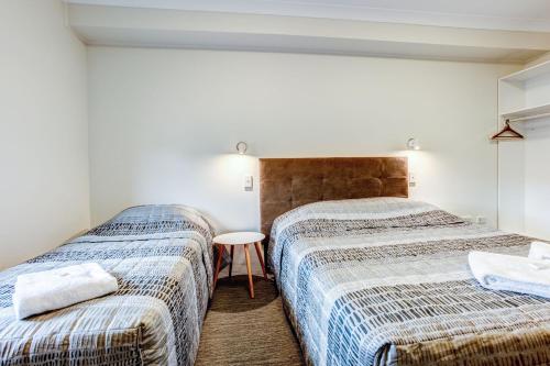 Arena Hotel (formerly Sleep Express Motel)にあるベッド