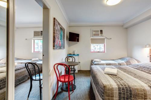 Arena Hotel (formerly Sleep Express Motel)にあるベッド