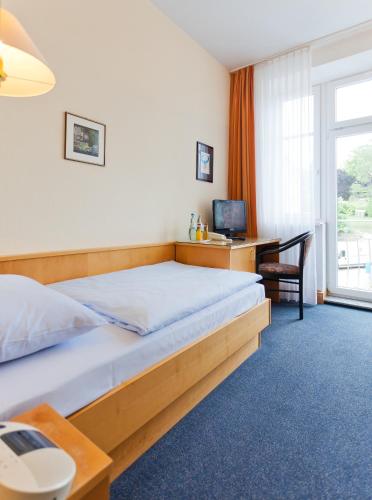 Ένα ή περισσότερα κρεβάτια σε δωμάτιο στο Hotel Villa Subklew