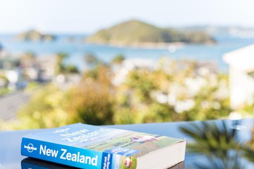 a blue book sitting on top of a table at Abri Apartments in Paihia