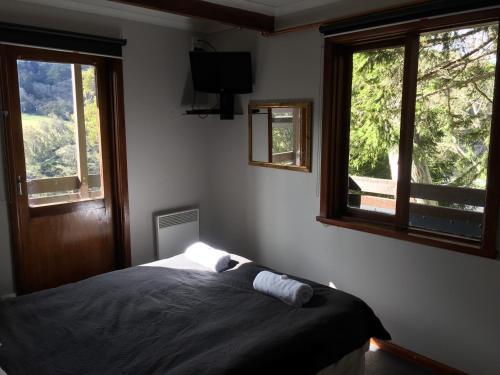 Ένα ή περισσότερα κρεβάτια σε δωμάτιο στο Winterhaus Lodge Thredbo Village