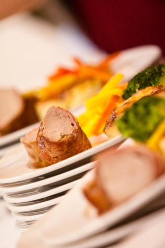 a plate of food with a fork and some food at Gasthof Martinhof in Sankt Martin im Sulmtal