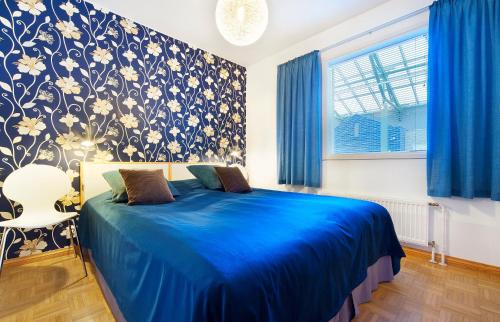 Voodi või voodid majutusasutuse Holiday Club Tampereen Kehräämö Apartments toas
