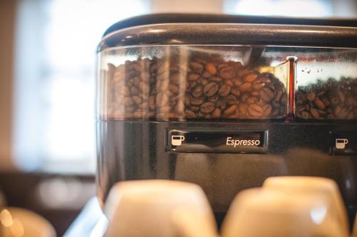 a bunch of coffee beans in a toaster at Hotel Alexander in Wiesbaden