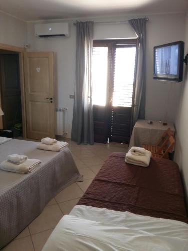 Ένα ή περισσότερα κρεβάτια σε δωμάτιο στο B&B Lavinaio