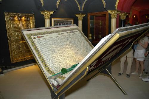a large mirror in a room with people standing around at El Mouradi Tozeur in Tozeur