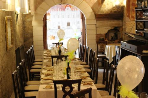 a long table in a restaurant with balloons on it at Villa Cosilinum in Padula